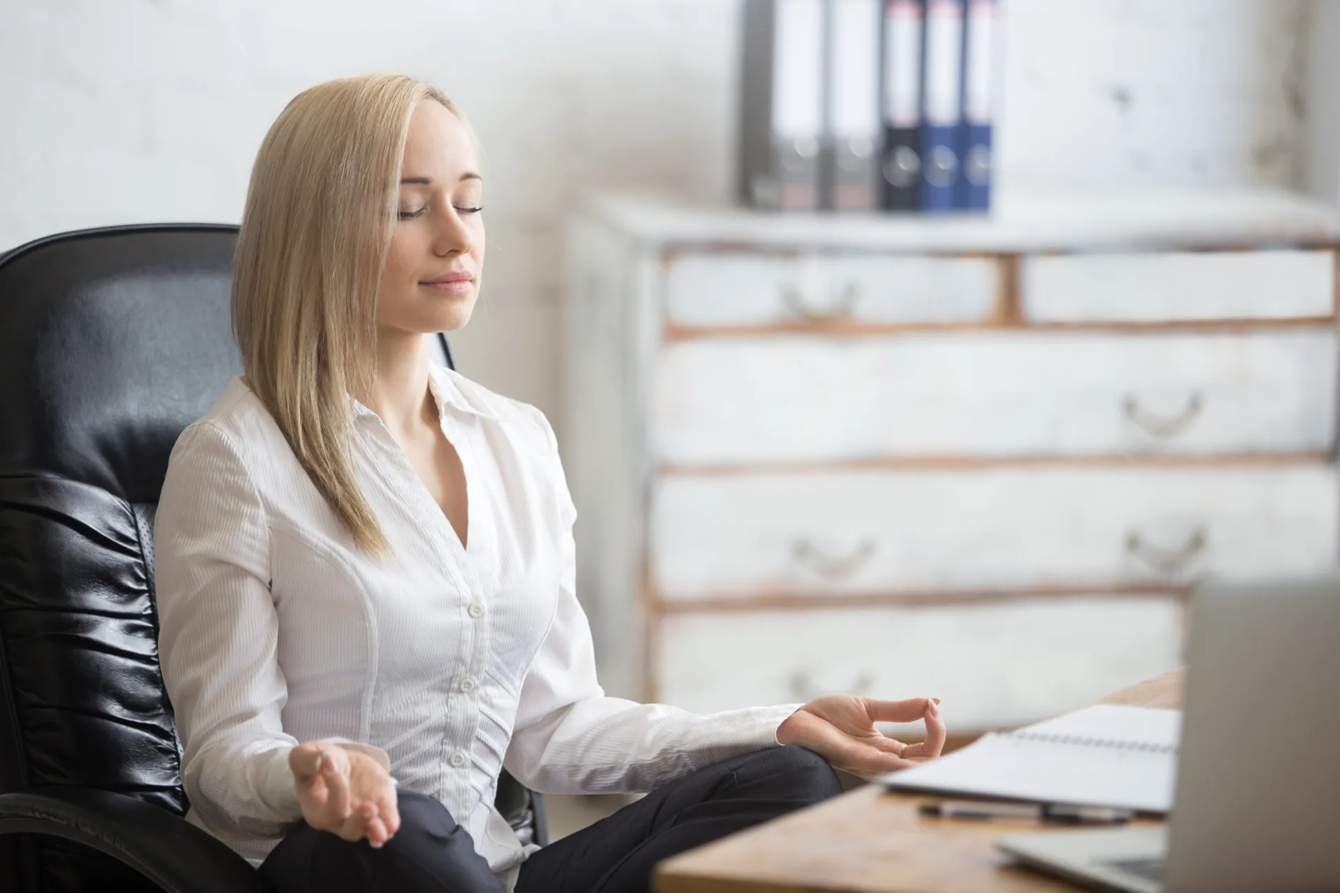 Woman resting in a yoga pose for stress management