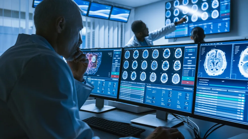 Radiologist reviewing whole body MRI scans